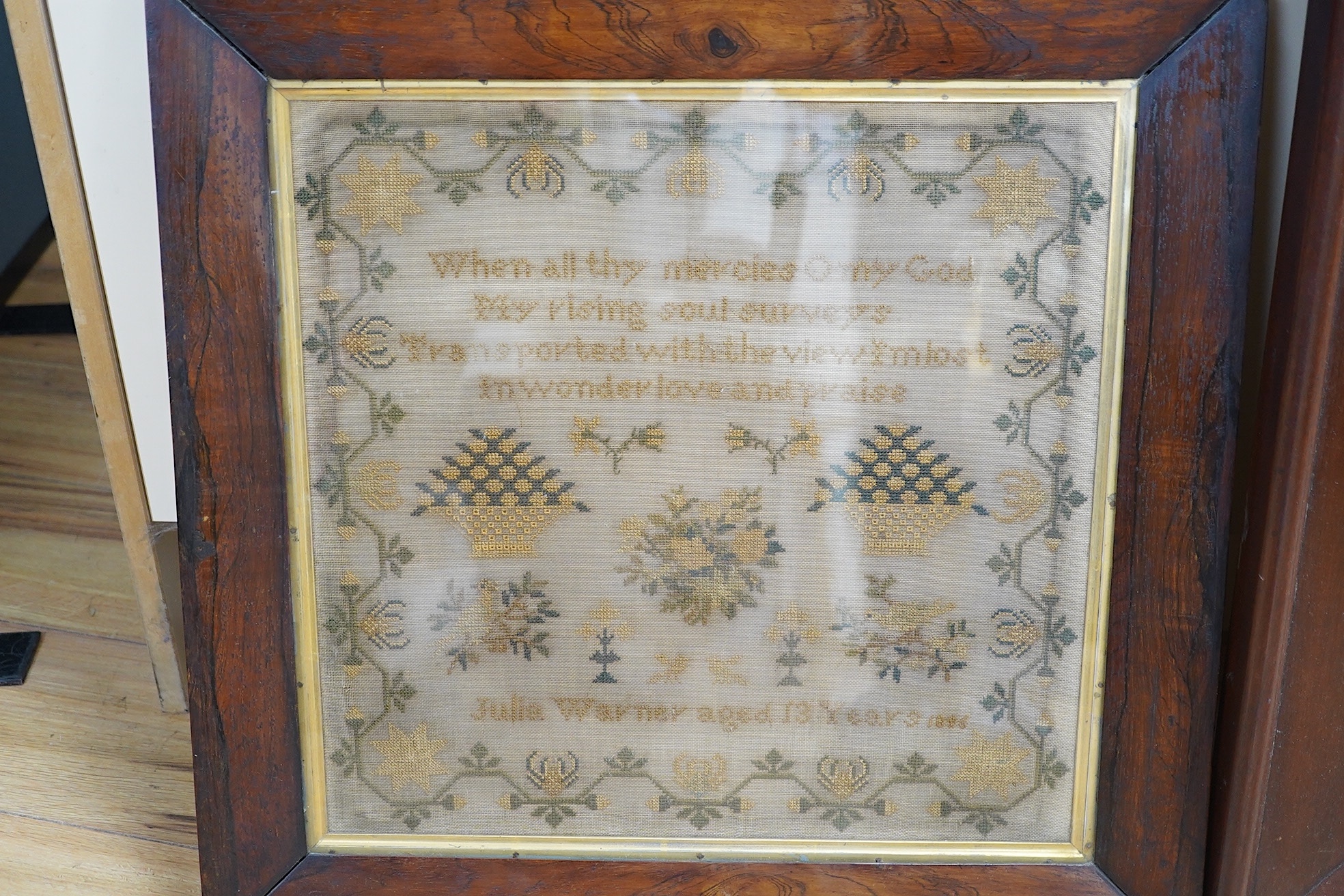 Two Victorian framed samplers; a large colourful floral sampler with short verse by Mary Burton 1862 and a smaller sampler by Julia Warner aged 13, dated 1846?, large 1862 sampler 59cm wide x 61cm high. Condition - large